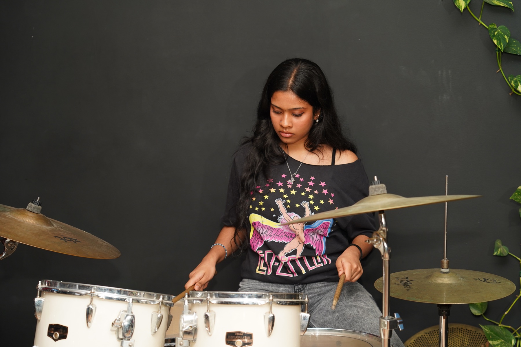 SARA Music School drum student performing on a full acoustic drum kit